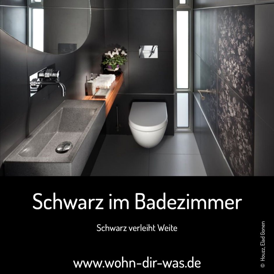 Интерьер ванной с ванной, унитазом и раковиной в черном цвете