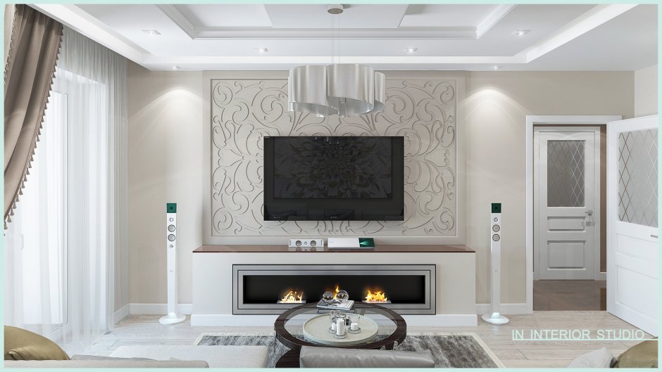 Молдинги и телевизор в интерьере гостиной