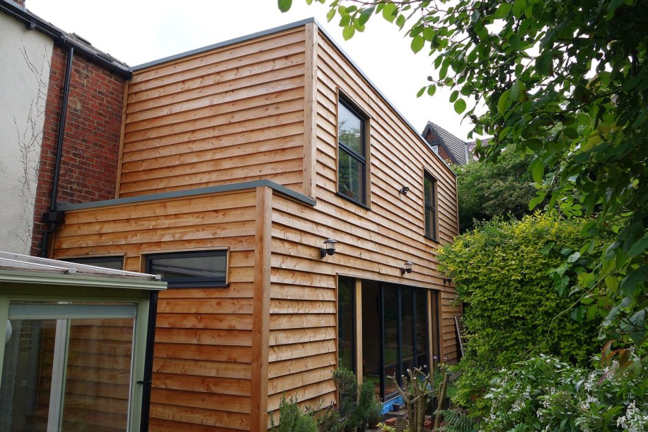 Дом обшитый доской