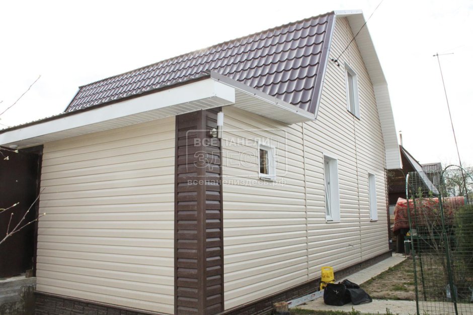 Деревянный дом обшитый профнастилом
