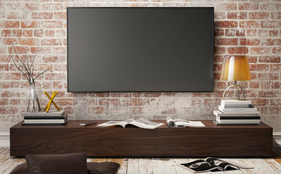 Телевизор на кирпичной стене