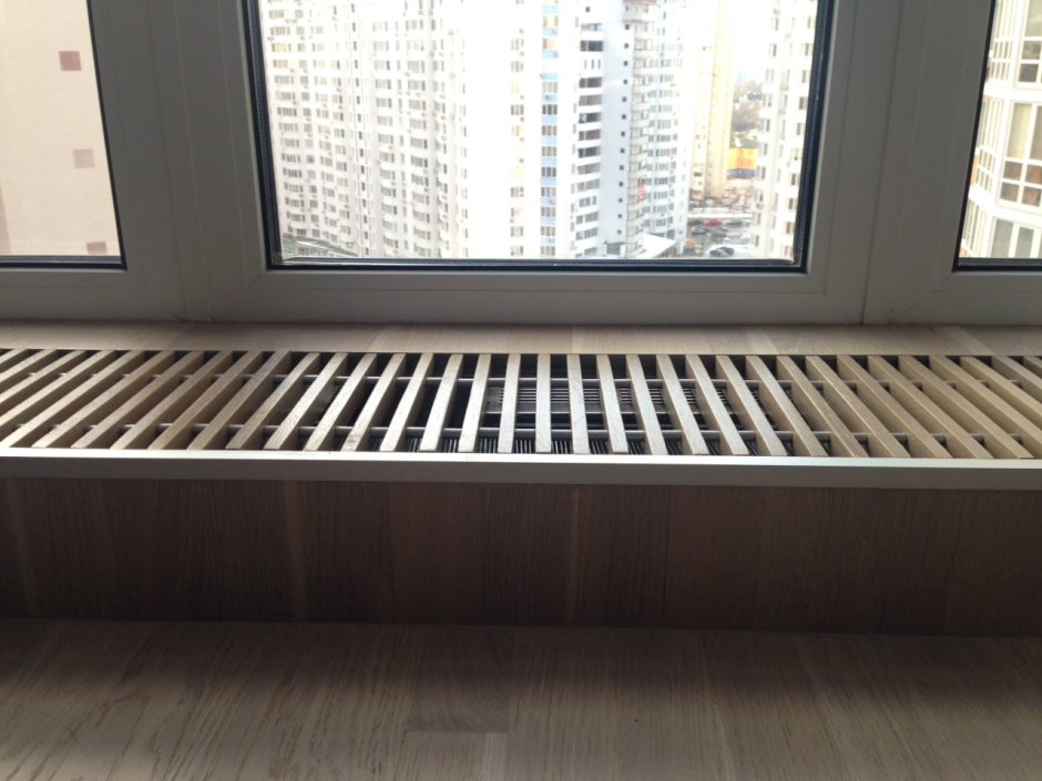 Внутрипольный конвектор под окном