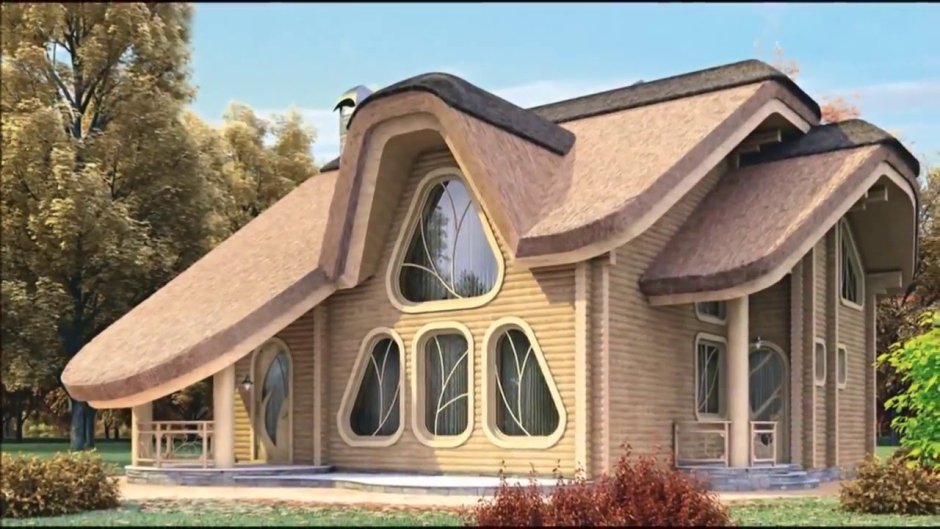 Дом с необычной крышей с мансардой