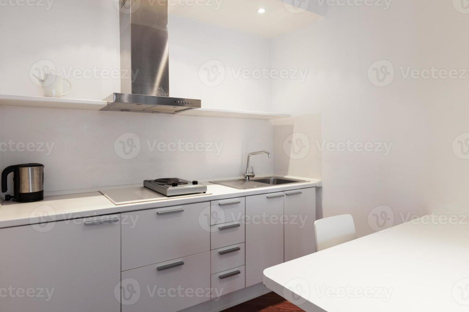 Белая прямая кухня без навесных шкафов