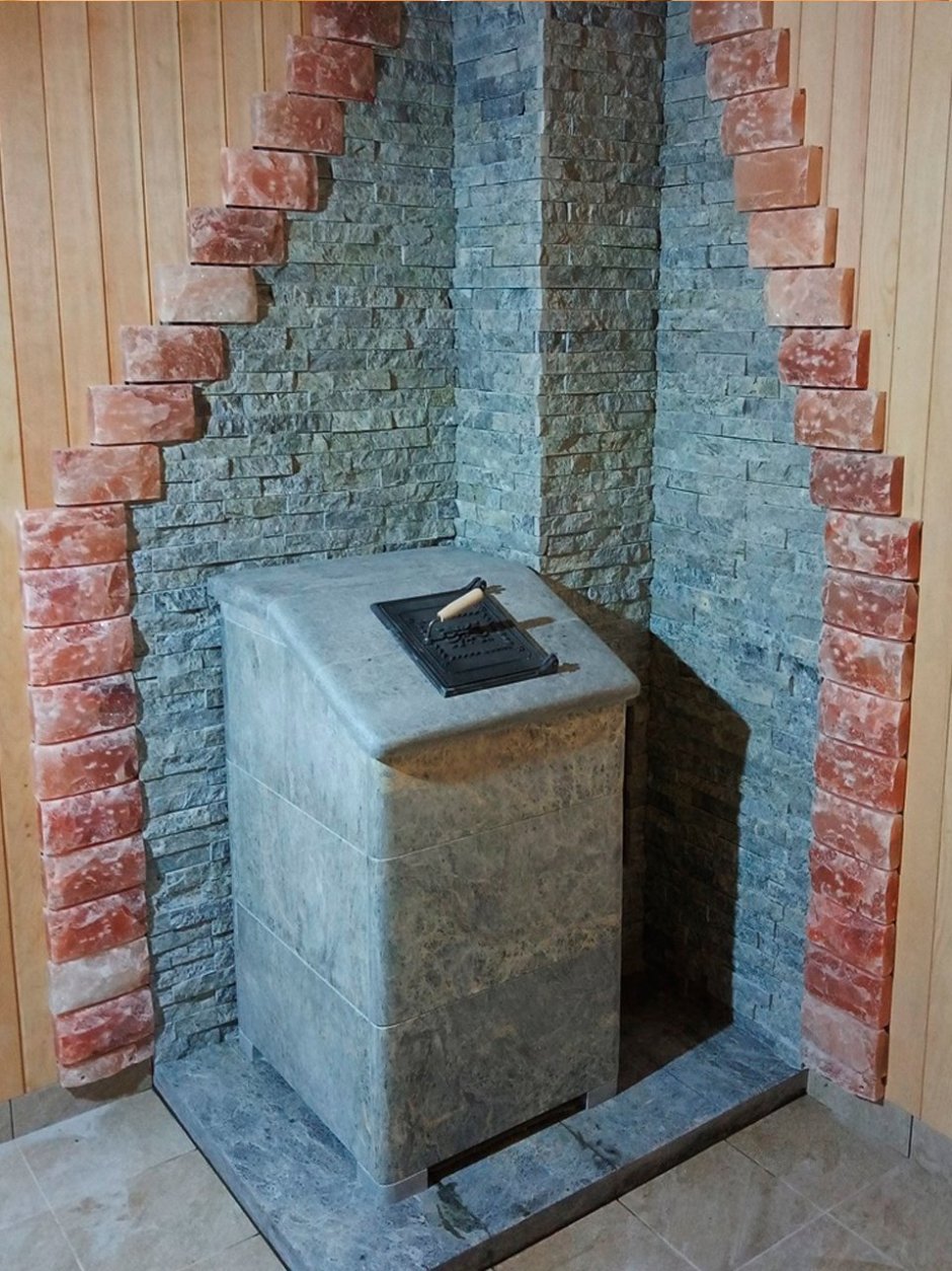 Банная печь Гефест обложенная камнем